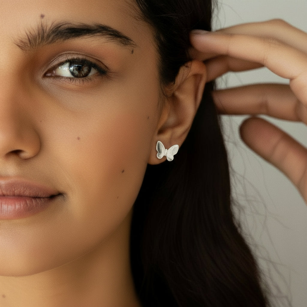 Flutterby Studs - Butterfly Earring Studs worn by a model, showcasing their whimsical design.