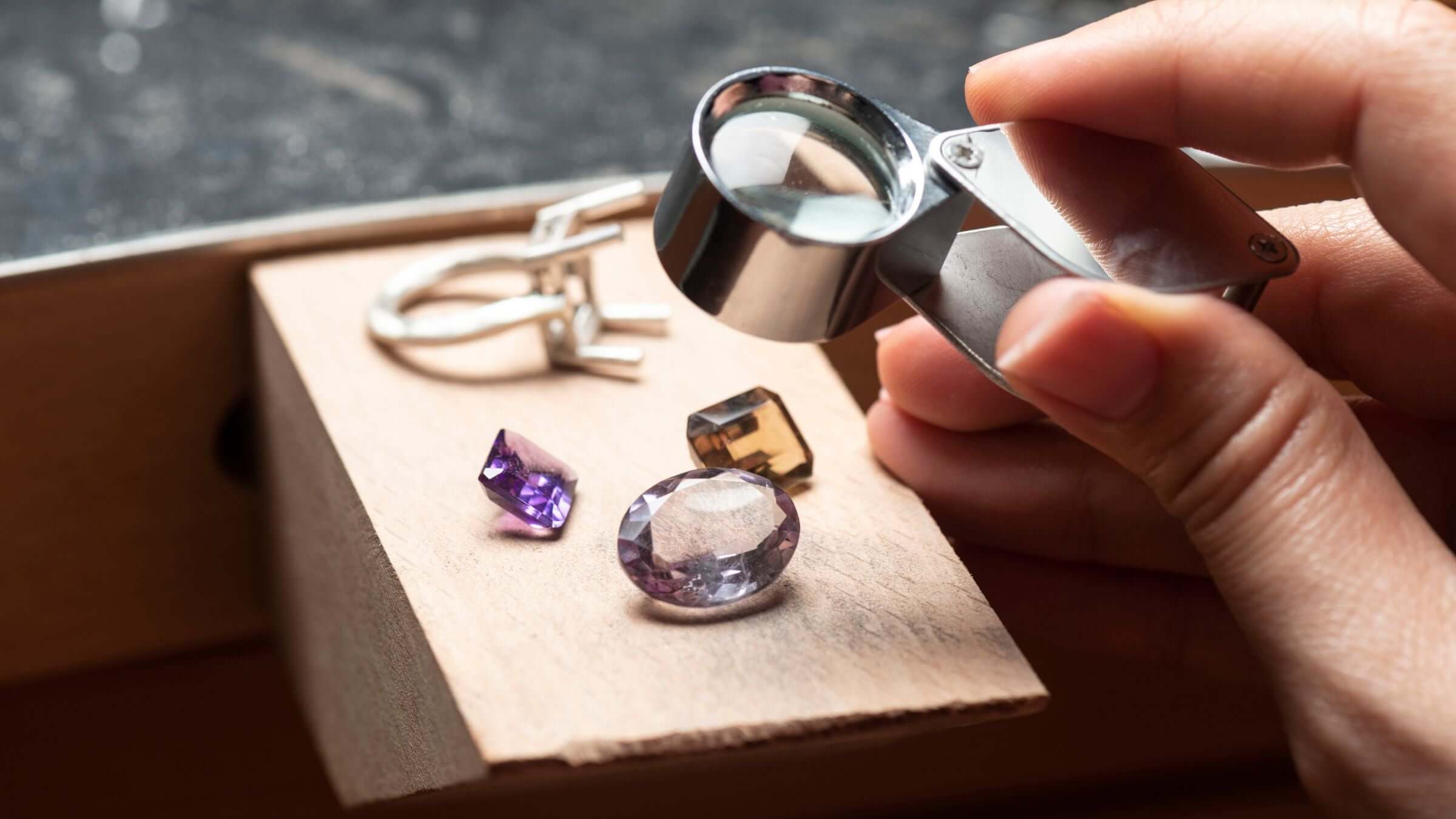 Exploring the craftsmanship of handcrafted jewellery journey with gems and tools.