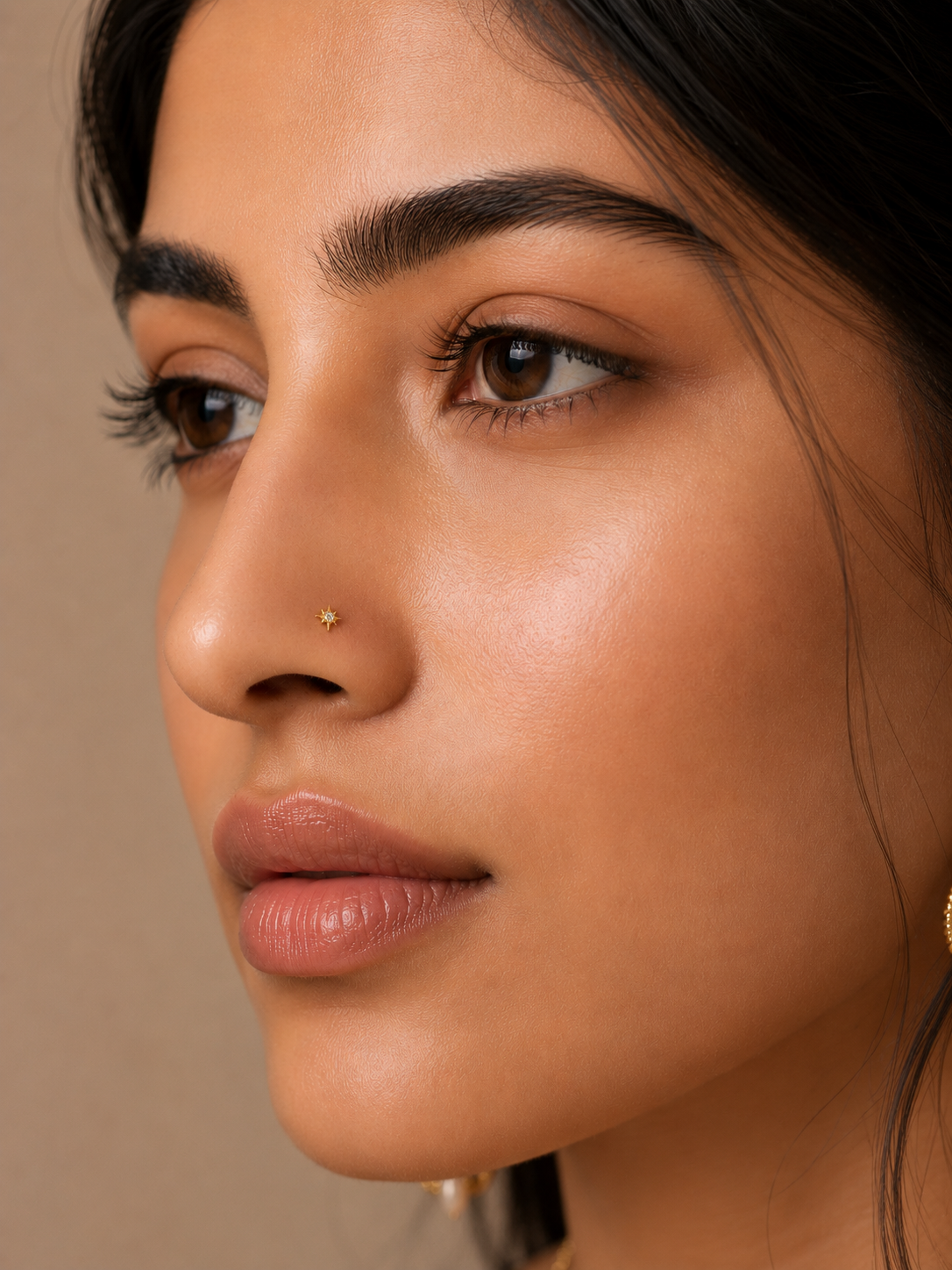 Close-up of a woman wearing a Ziya Diamond Nose Pin, featuring a tiny star design with a sparkling CZ diamond.