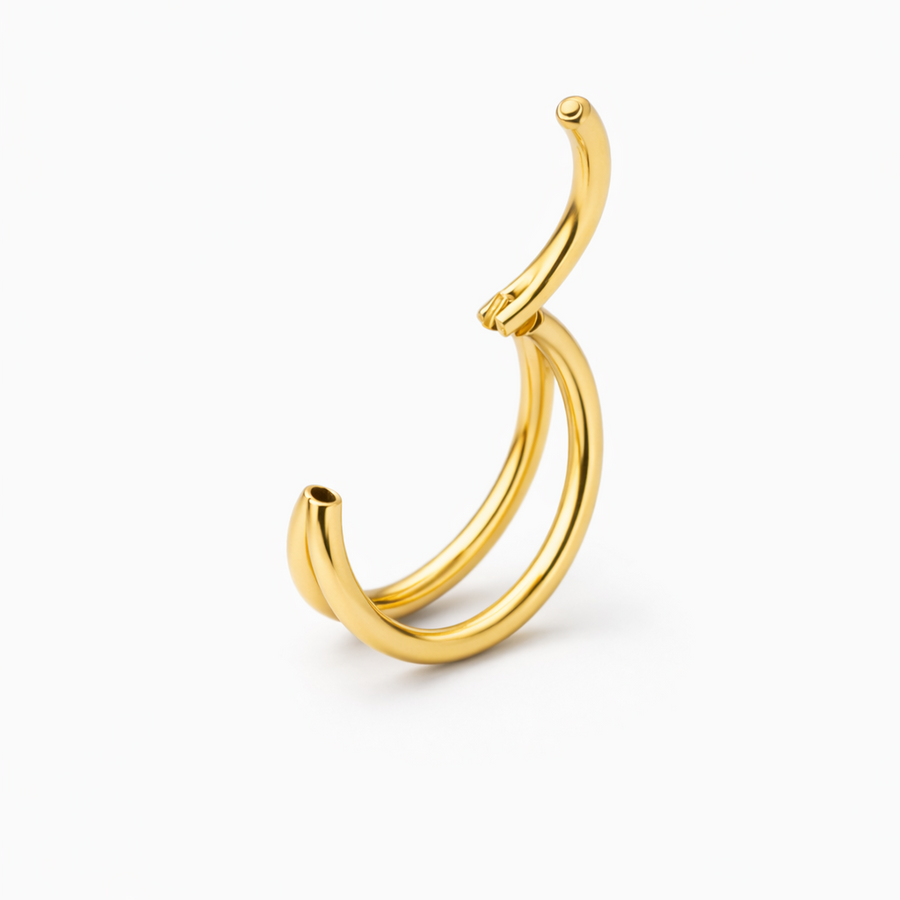 The Reya Double Band Nose Ring in gold with two fine parallel bands for a layered look.