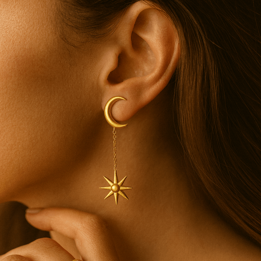 Ray of Light Earrings featuring a sun and moon design, showcased elegantly on a model's ear.