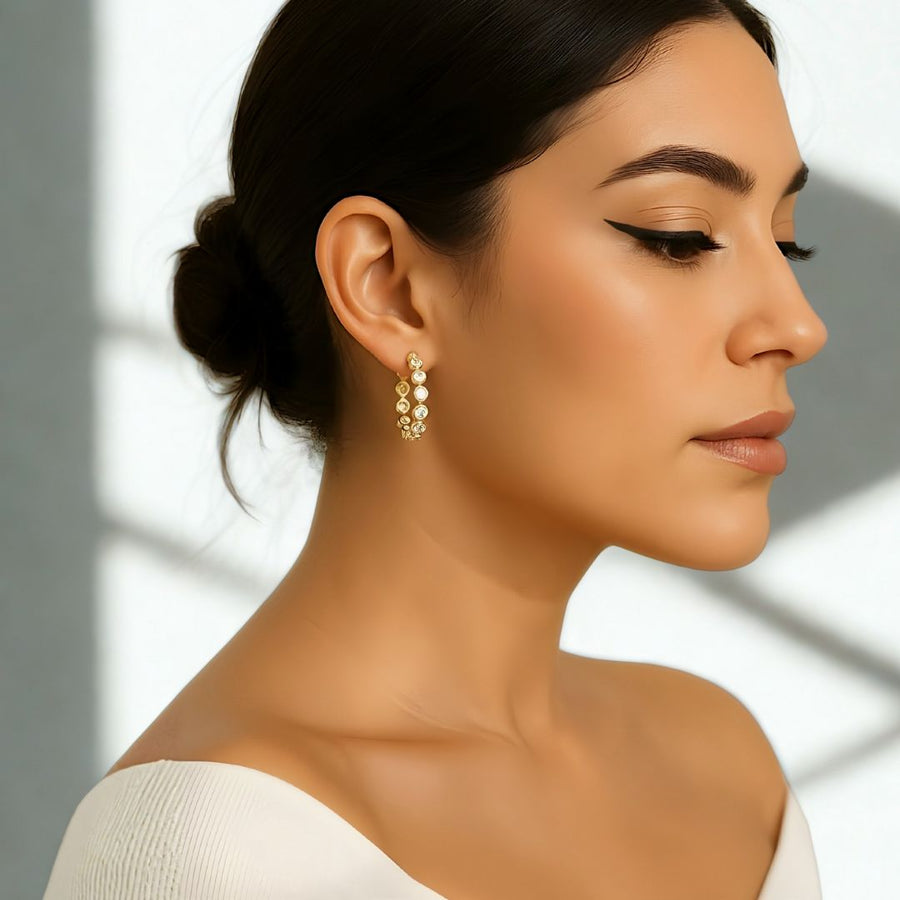 Celeste diamond hoops showcased on a model, highlighting their sparkle and elegant design in sterling silver.