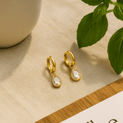 Diamond Dew Drops earrings featuring teardrop-cut cubic zircon set in gold vermeil against a neutral background.