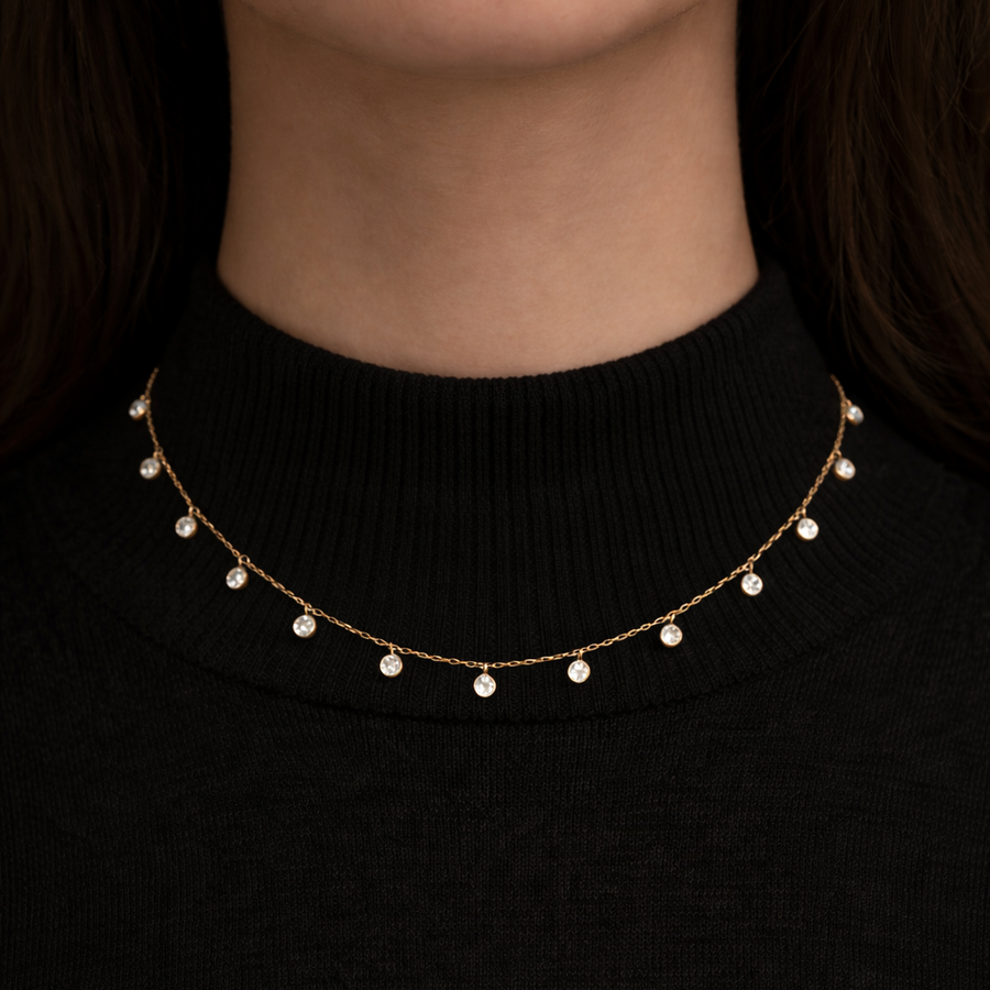 Celeste Diamond Necklace worn on a black turtleneck, featuring high-grade cubic zircon diamonds on a delicate chain.