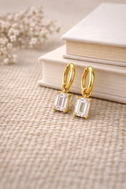 Everyday diamond earrings featuring elegant gold hoops and sparkling cubic zircon stones.