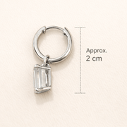 Everyday diamond earrings featuring a single solitaire high-grade cubic zircon diamond on a silver hoop.