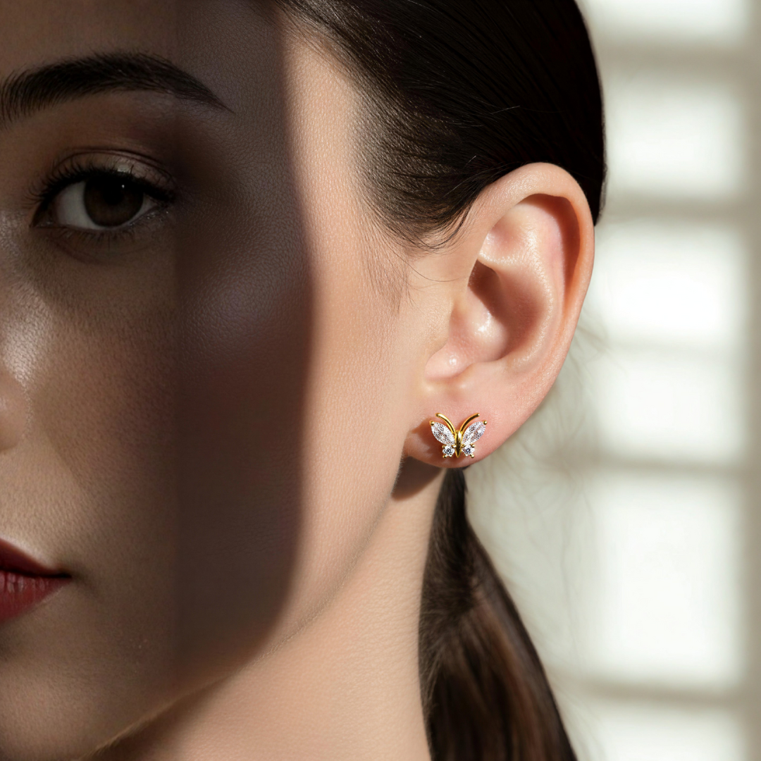 Isla Butterfly Diamond Stud Earrings worn by a model showcasing their elegant design and sparkle.