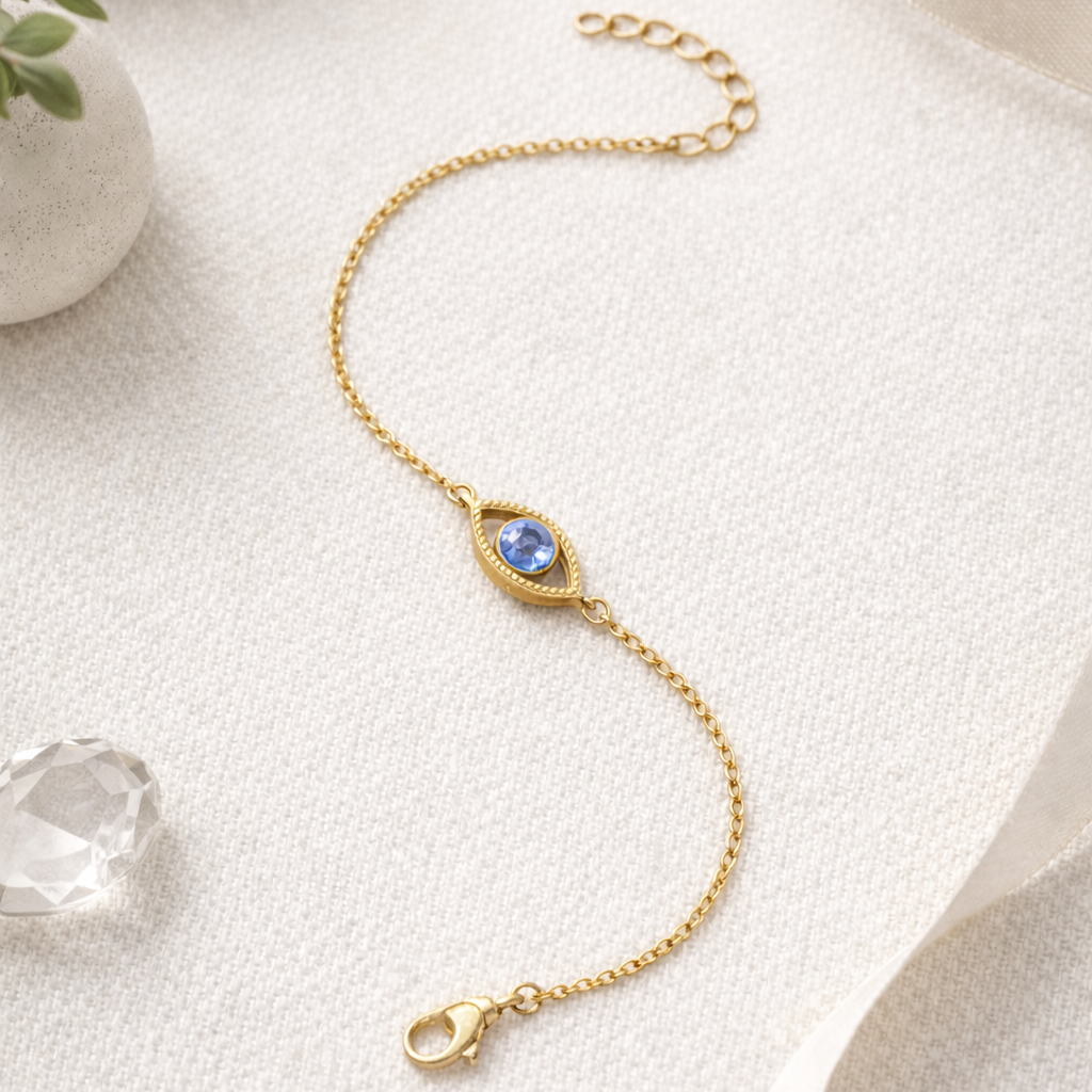 Netra - The contemporary evil eye bracelet featuring a blue gemstone in a gold vermeil setting on a delicate chain.