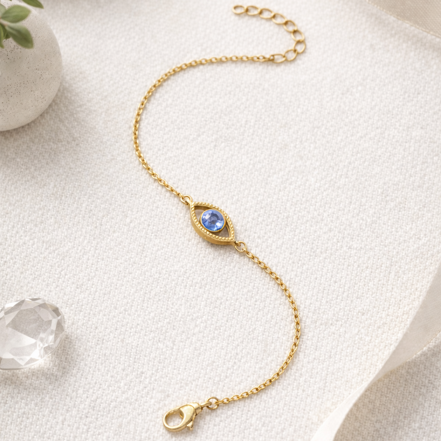 Netra - The contemporary evil eye bracelet featuring a blue gemstone in a gold vermeil setting on a delicate chain.