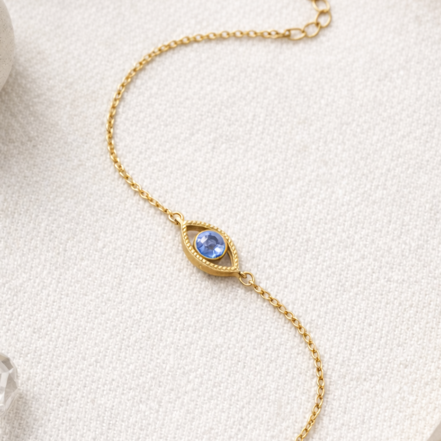 Netra - The contemporary evil eye bracelet featuring a blue stone in a gold vermeil setting.