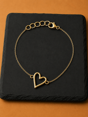 Mehr Heart Bracelet featuring a delicate open heart charm on a gold chain.